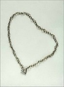 “Kamma Necklace”, gold, matte black silver and diamond.